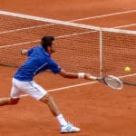 A tennis player swinging a racket