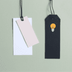 Blank price tags in a green wall